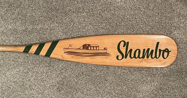 Shambo Paddle. Hand drawn boat image laser etched. "Shambo" painted in green